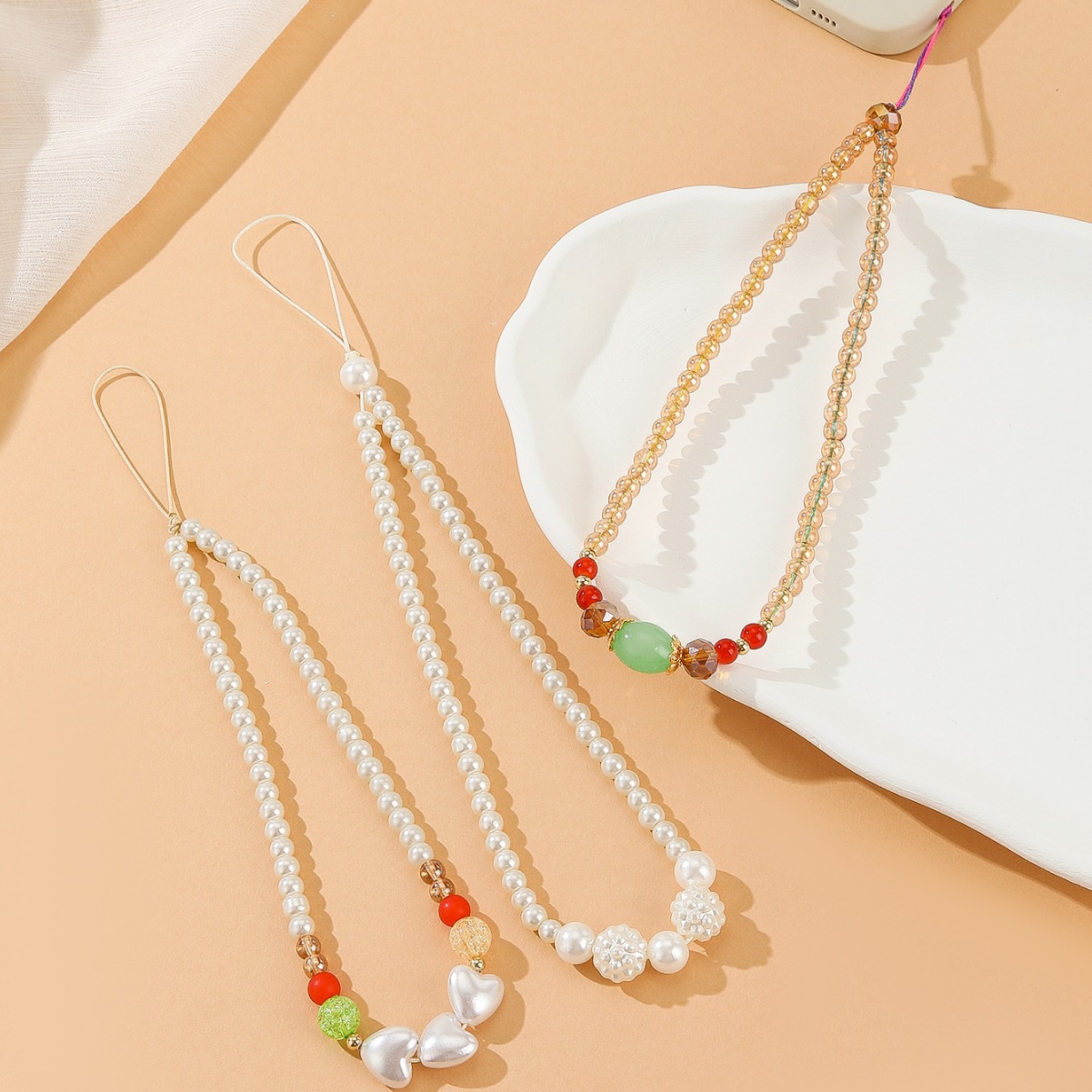 新款小香风时尚简约珍珠手机链爱心串珠防丢手机挂绳-阿里巴巴