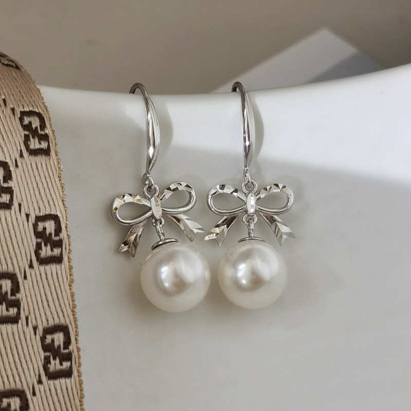 小清新新款s925银耳环可爱风蝴蝶结耳饰气质女款长款珍珠耳吊