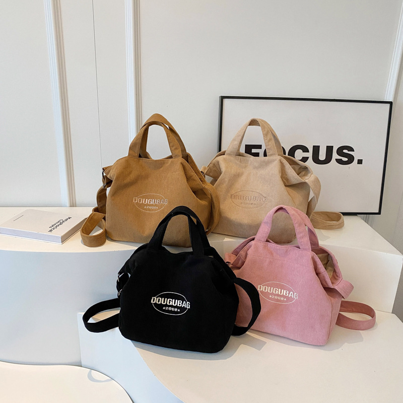 批发新款条绒斜挎包大容量休闲妈咪包单肩字母刺绣学生书包手提包