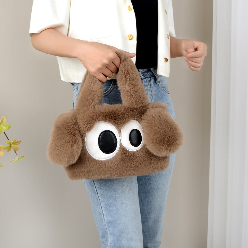 毛毛包2023秋冬新款可爱大眼小狗手提包斜挎包包毛绒水桶包-阿里巴巴