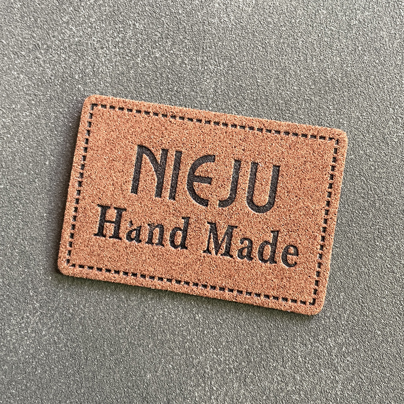 超纤压花logo真皮皮标 pu仿皮商标皮牌 服装箱包商标厂家直销