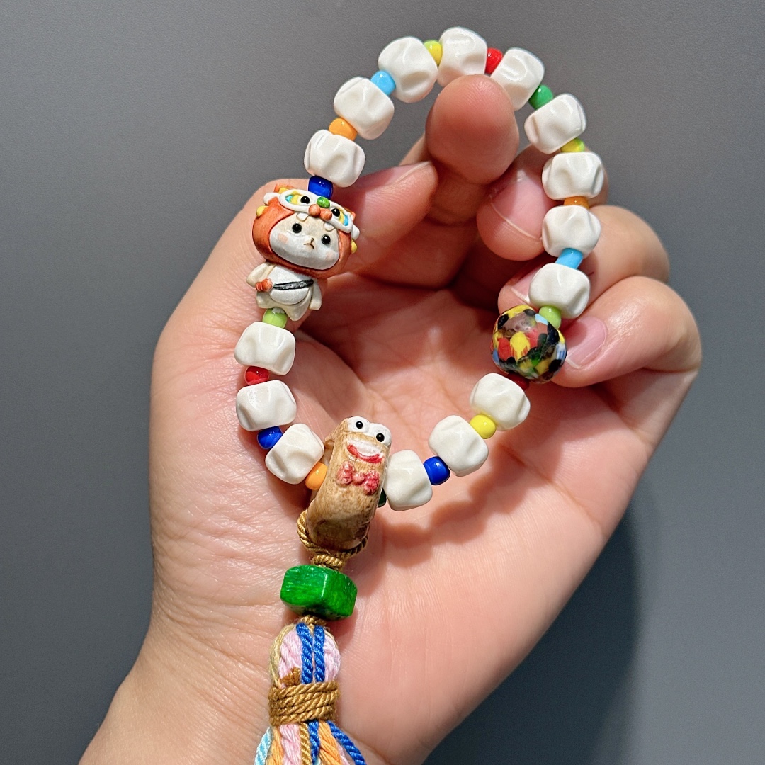 牛骨百香籽搭配鹿角醒狮宝宝趣多多跑环等时尚手链随机发货-阿里巴巴