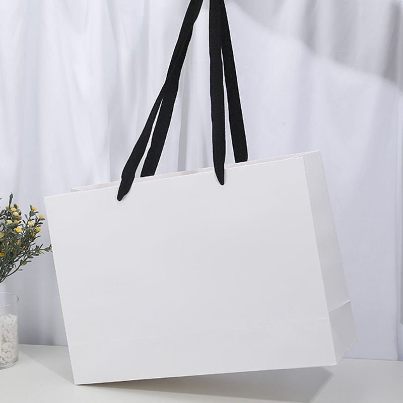 服装店手提袋纸袋现货女装衣服购物礼品包装厚款高档加长绳印logo