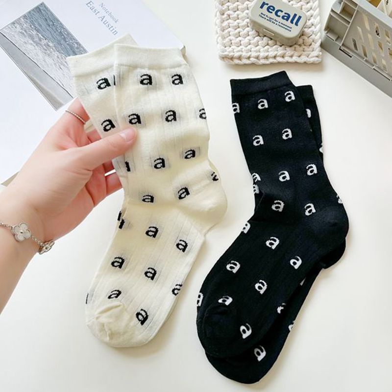 春夏薄款黑白时尚高级感小a字母提花袜子女网红ins镂空性感中筒袜