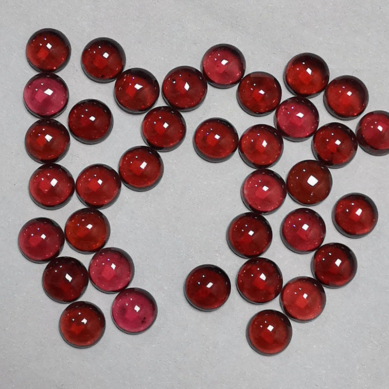 圆形红石榴石宝石平底光面珠宝戒面莫桑比克石榴石裸石加工厂家