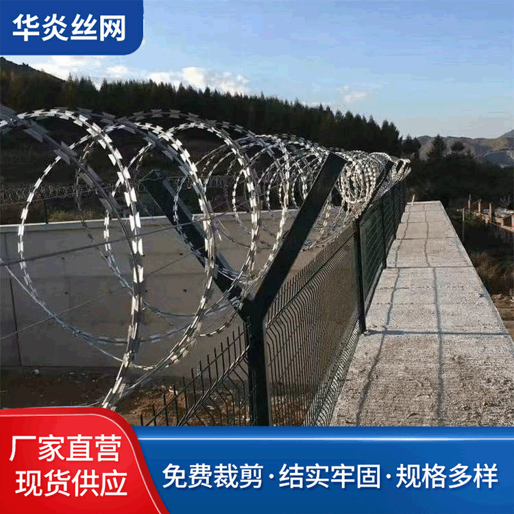 边境防偷渡螺旋式刀片刺网 蛇腹型刺丝滚笼热镀锌围墙防爬刺绳