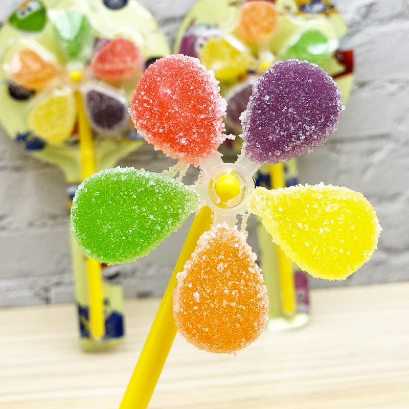 金稻谷七彩旋转大风车糖棒棒糖维c软糖送儿童糖果整箱批发零食