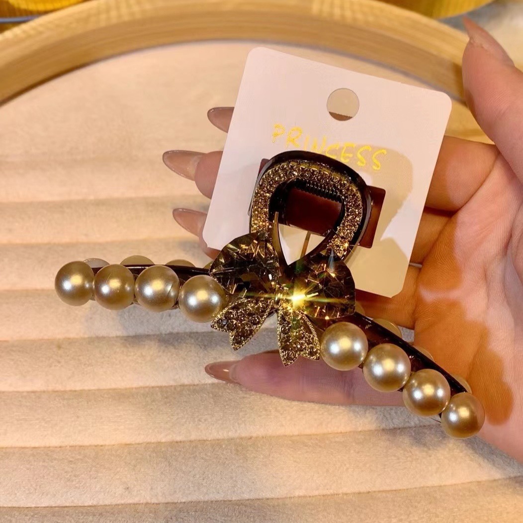 新款亮闪韩版高级感蝴蝶结珍珠发夹网红百搭发饰抖音代发现货饰品