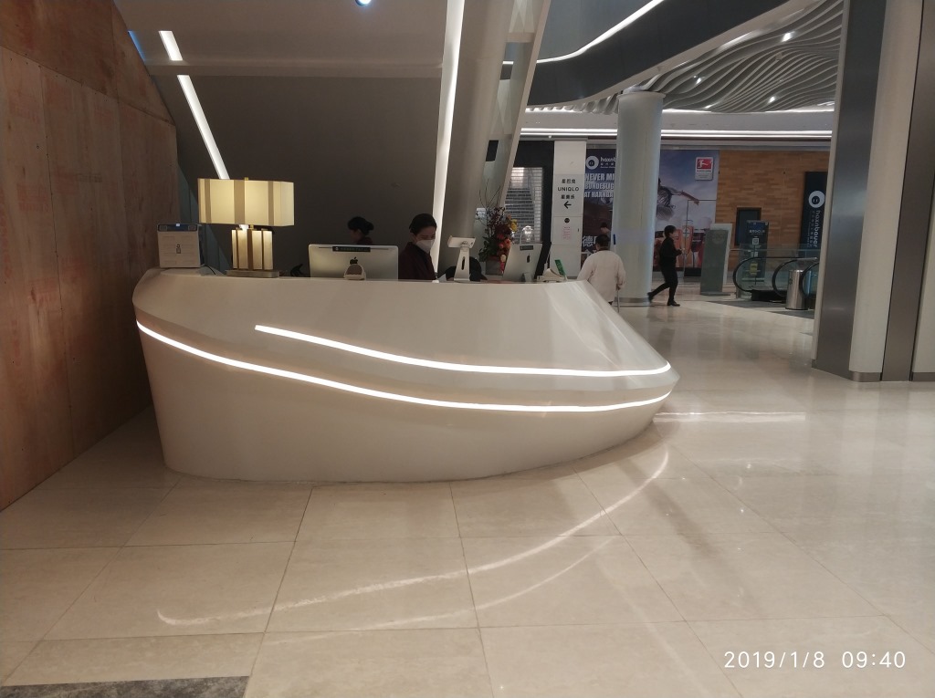 商场大堂亚克力人造石服务台/水吧台/咨询台人造石弧形镂空造型