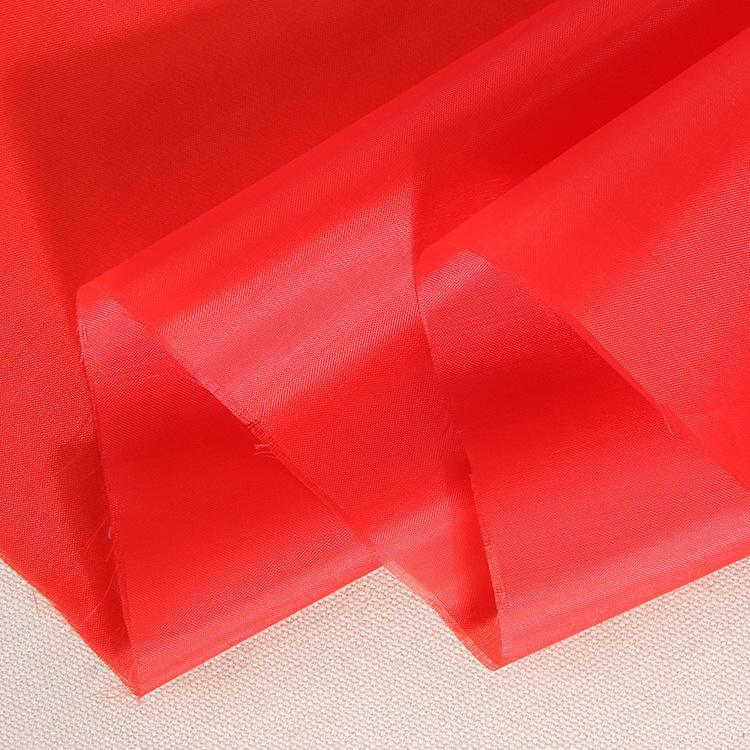 现货170t涤塔夫 剪彩大红绸布面料彩旗布服装里布 婚庆装饰用布