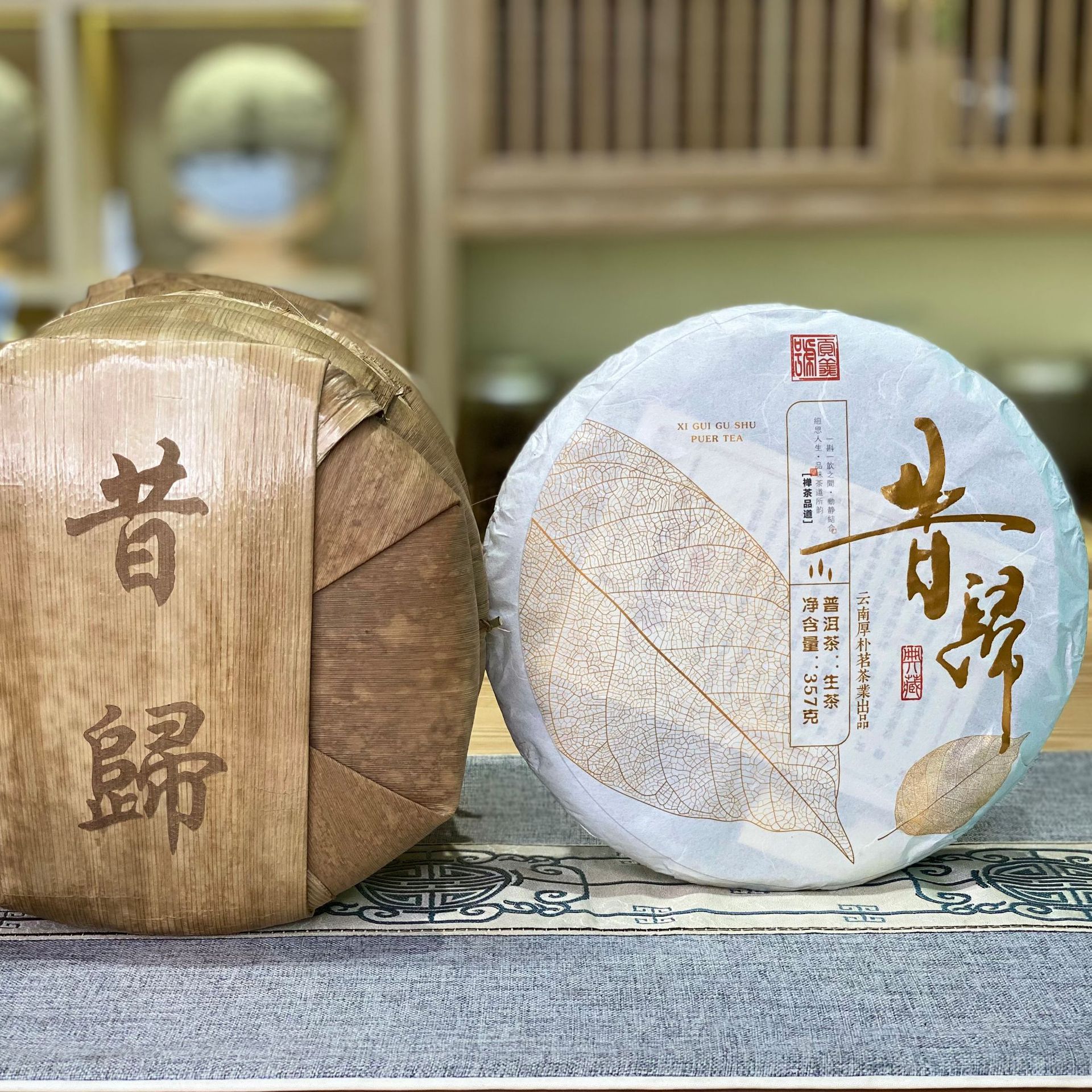 批发云南昔归普洱茶生茶临沧gu树生茶七子饼纯料生普春茶茶叶357g