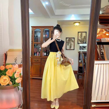 黄色半身裙女夏小众设计感松紧腰垂感中长款高腰显瘦气质a字伞裙
