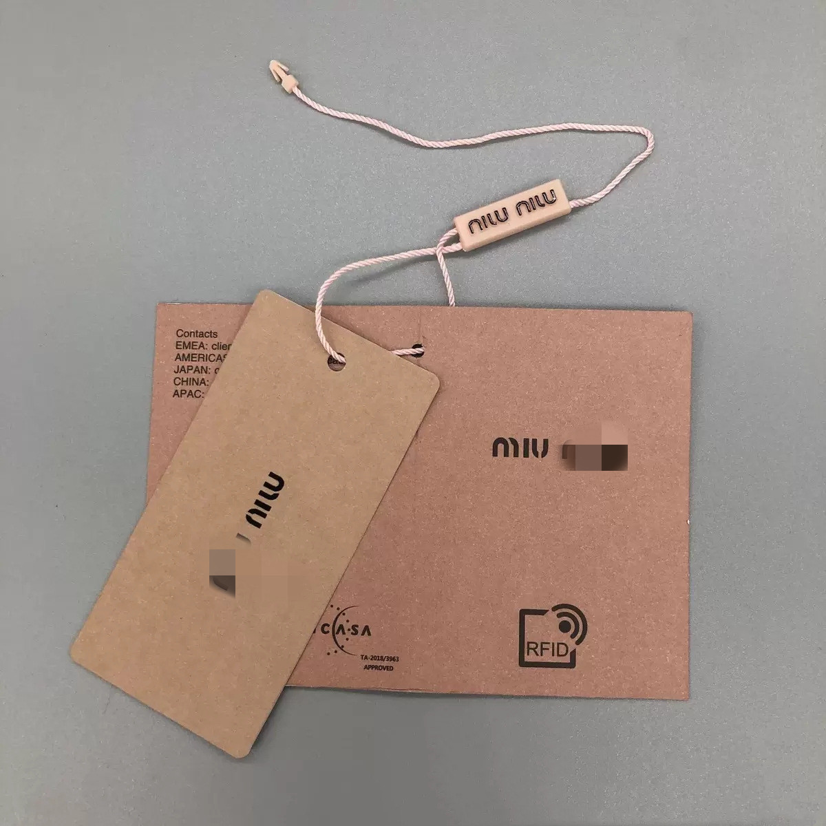 miumiu服装辅料大牌缪缪吊牌吊粒领标洗水标包装袋现货