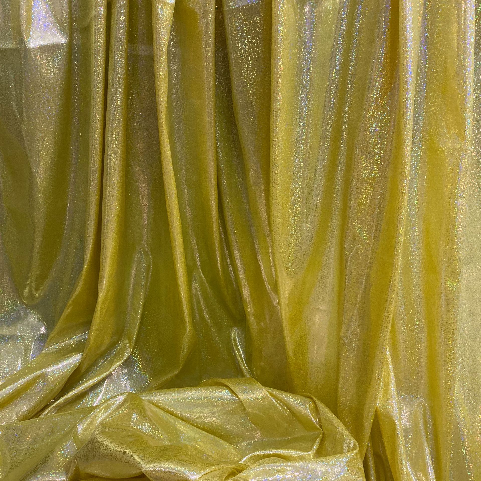 镭射幻彩针织布七彩闪亮点满版烫金布料舞台演出服装拍摄背景面料