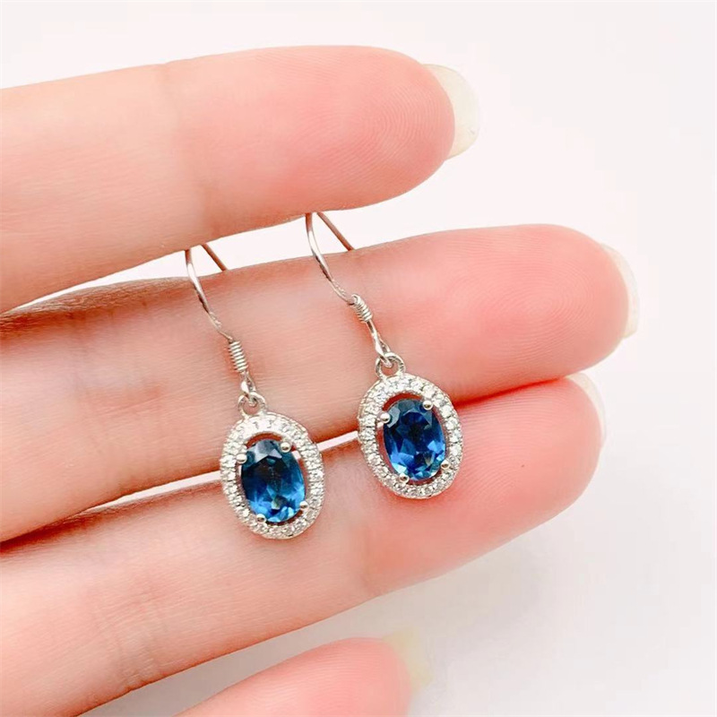 鑫亿鹏s925纯银镶嵌椭圆形蓝色托帕石耳钩女式耳坠白金色日韩时尚