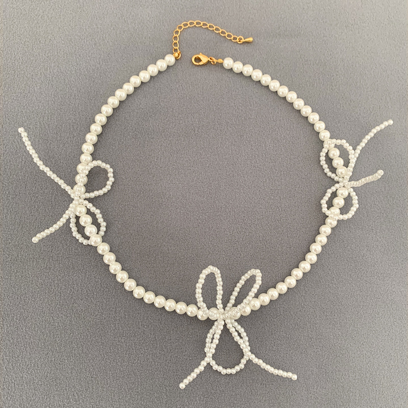 轻奢小众设计高级感仿施珍珠编织蝴蝶结项链女2024年新款锁骨颈链