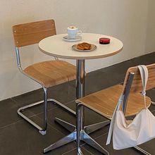 设计师餐椅家用餐厅椅子现代简约复古弯曲木靠背椅黑色金属弓形椅
