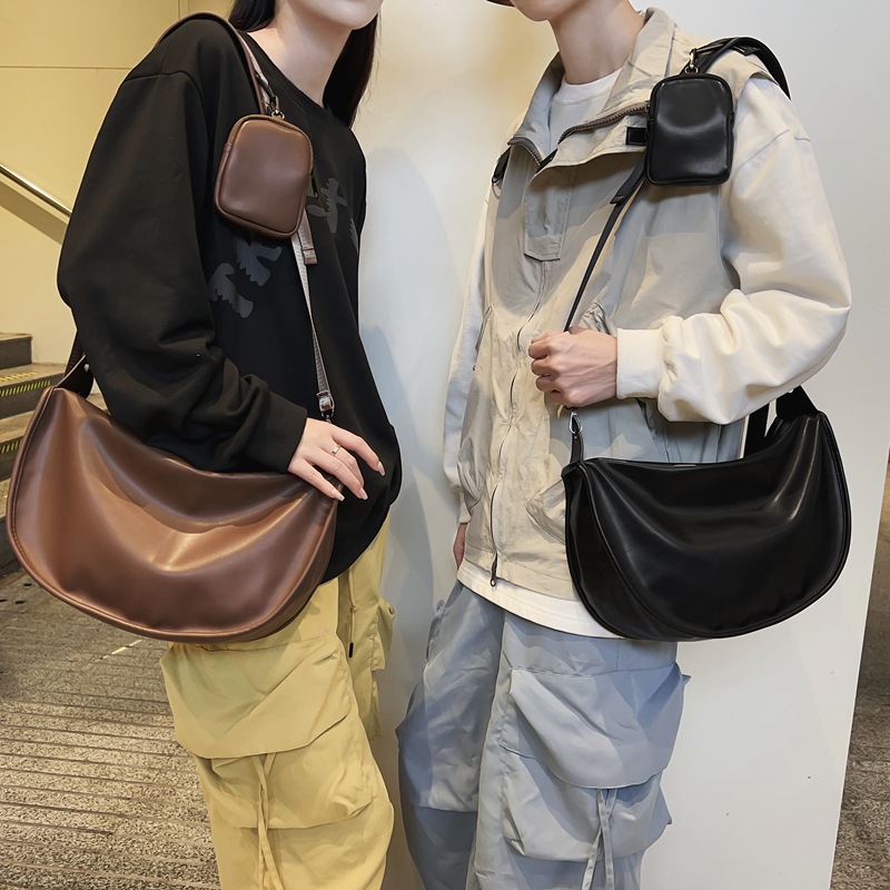 网红饺子包睿营 简约情侣单肩背包大容量ins潮牌女斜挎包耳机包