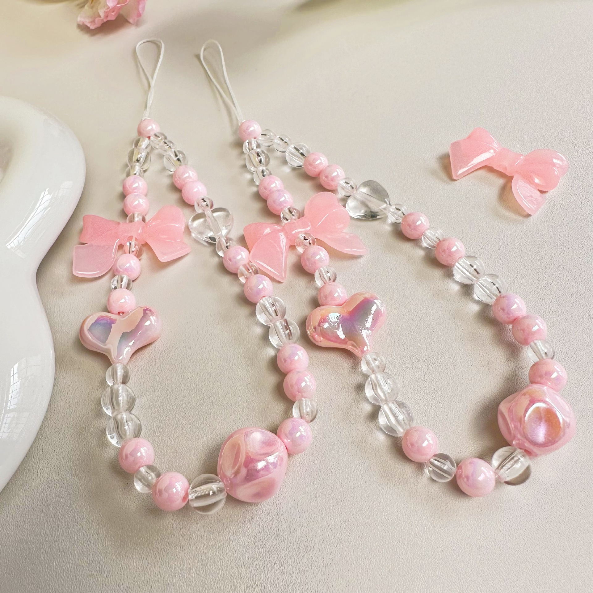少女透粉色果冻蝴蝶结手机链手机壳串珠挂饰挂件防摔链条手机挂绳