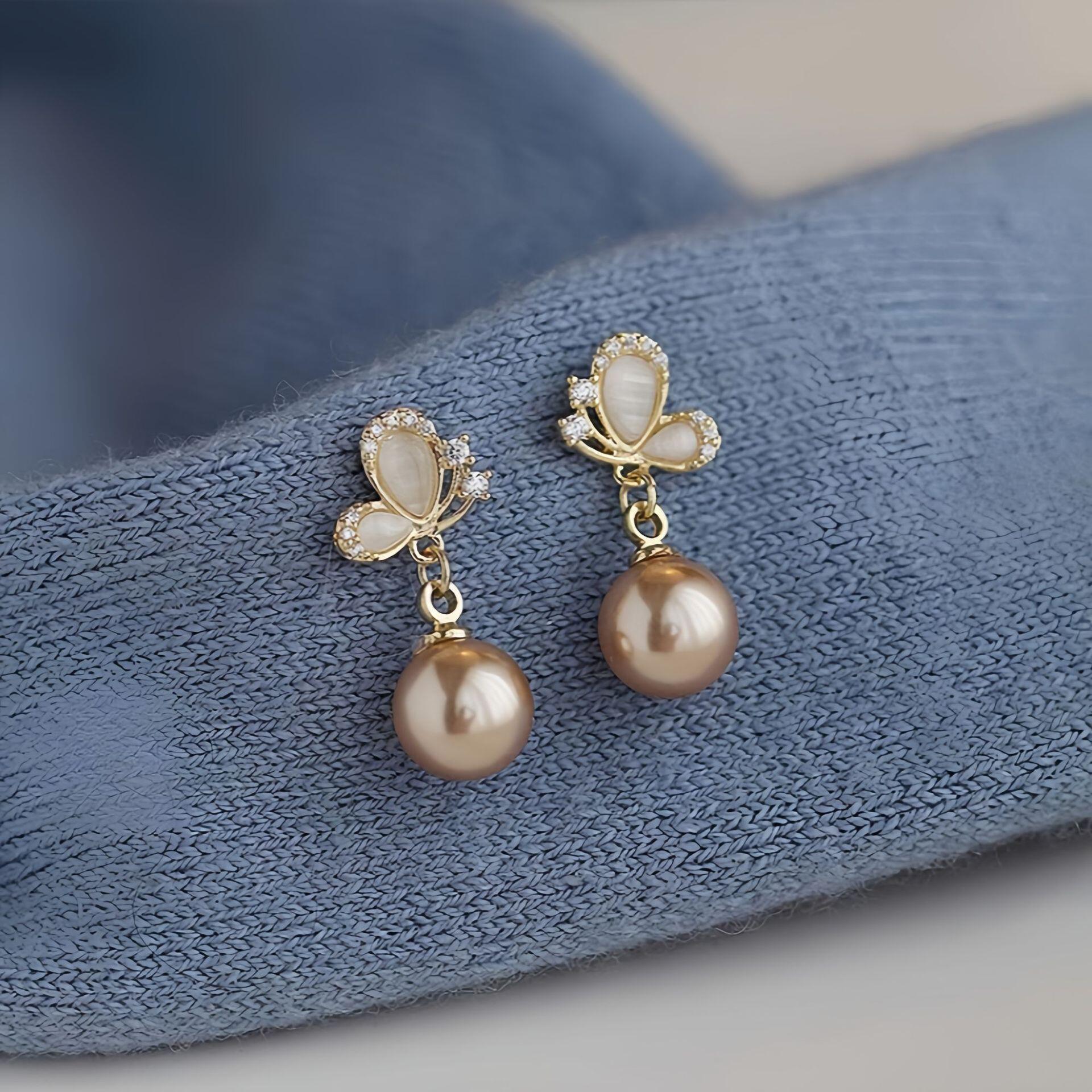 高级感香槟色珍珠猫眼石蝴蝶耳钉女2024新款爆款小众气质耳环耳饰