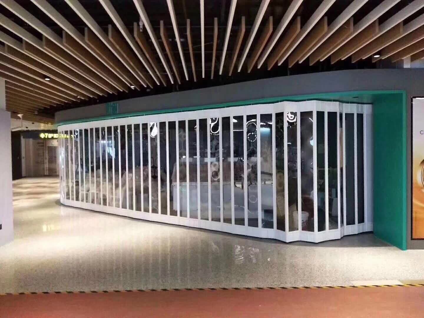 商场商铺弧形推拉水晶折叠门铝合金边框推拉门水晶门母婴店折叠门