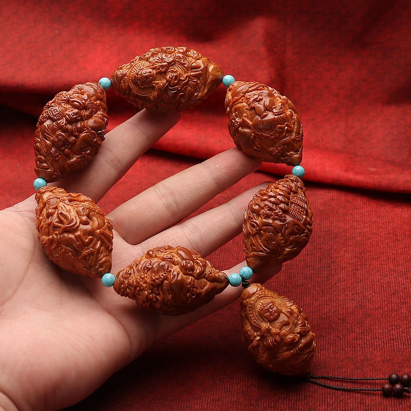 印尼橄榄核雕刻浮雕天上人间万佛群仙手把件金蟾财神手把手球文玩