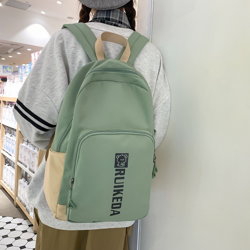 2023 New Casual Fashion Trend Backpack Wholesale Large Capacity Solid Color Letter Backpack Middle School Student Schoolbag