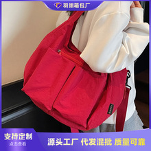 外单休闲大包包女2025新款时尚通勤饺子包轻便大容量单肩斜挎布包