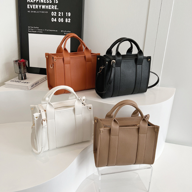 大容量托特包批发2023新款时尚手提通勤包休闲单肩斜挎包女-阿里巴巴