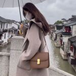 韩版时尚连帽宽松呢大衣女2025秋冬新款轻奢感中长款毛呢外套
