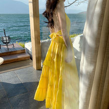 2024年夏季新款旅游度假裙海边沙滩裙黄色长裙超仙挂脖露背连衣裙