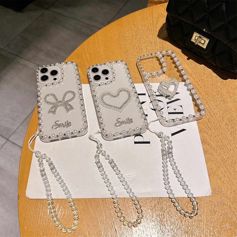 韩风珍珠蝴蝶结iPhone15手机壳适用苹果14Promax爱心13透明12水钻