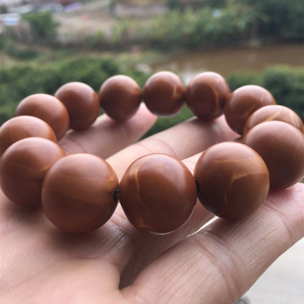 厂家直供橄榄核光珠手串橄榄核圆珠男士大手串广东老铁核素核手链