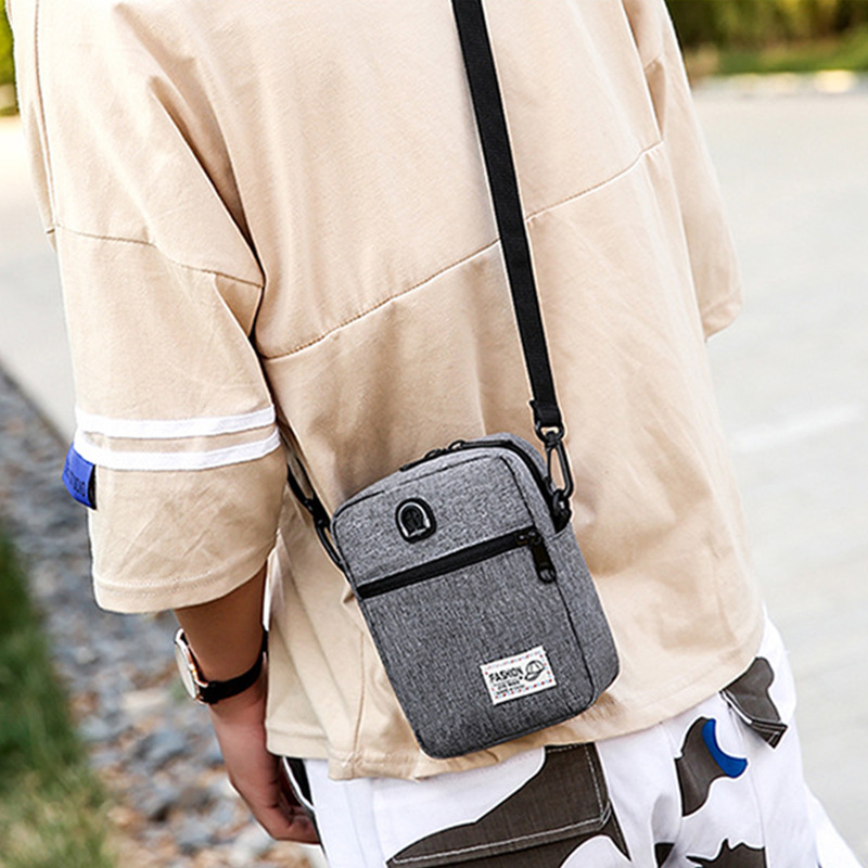 男士斜挎包时尚青年商务竖款休闲涤纶单肩包纯色日韩简约通勤男包