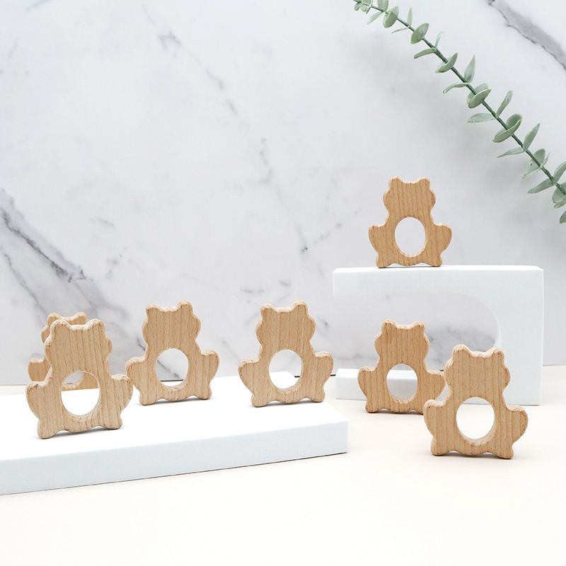 定制卡通造型镂空纯手工新生儿木质牙胶婴幼儿口欲期榉木磨牙棒