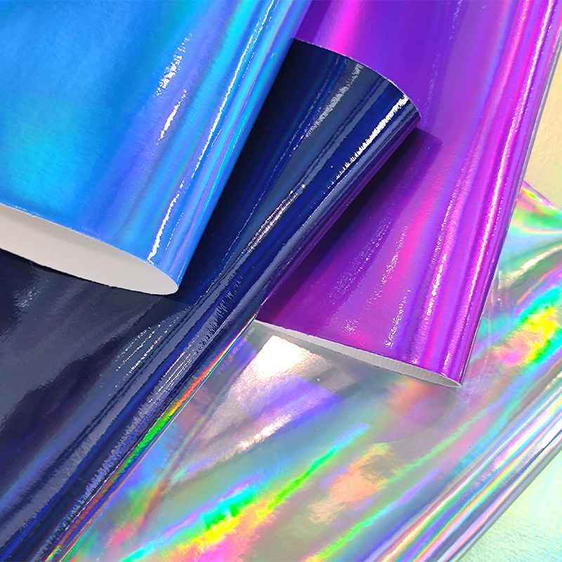 跨境代销亮面镭射镜面pu毛底幻彩金属pu人造革手工收纳化妆服装料