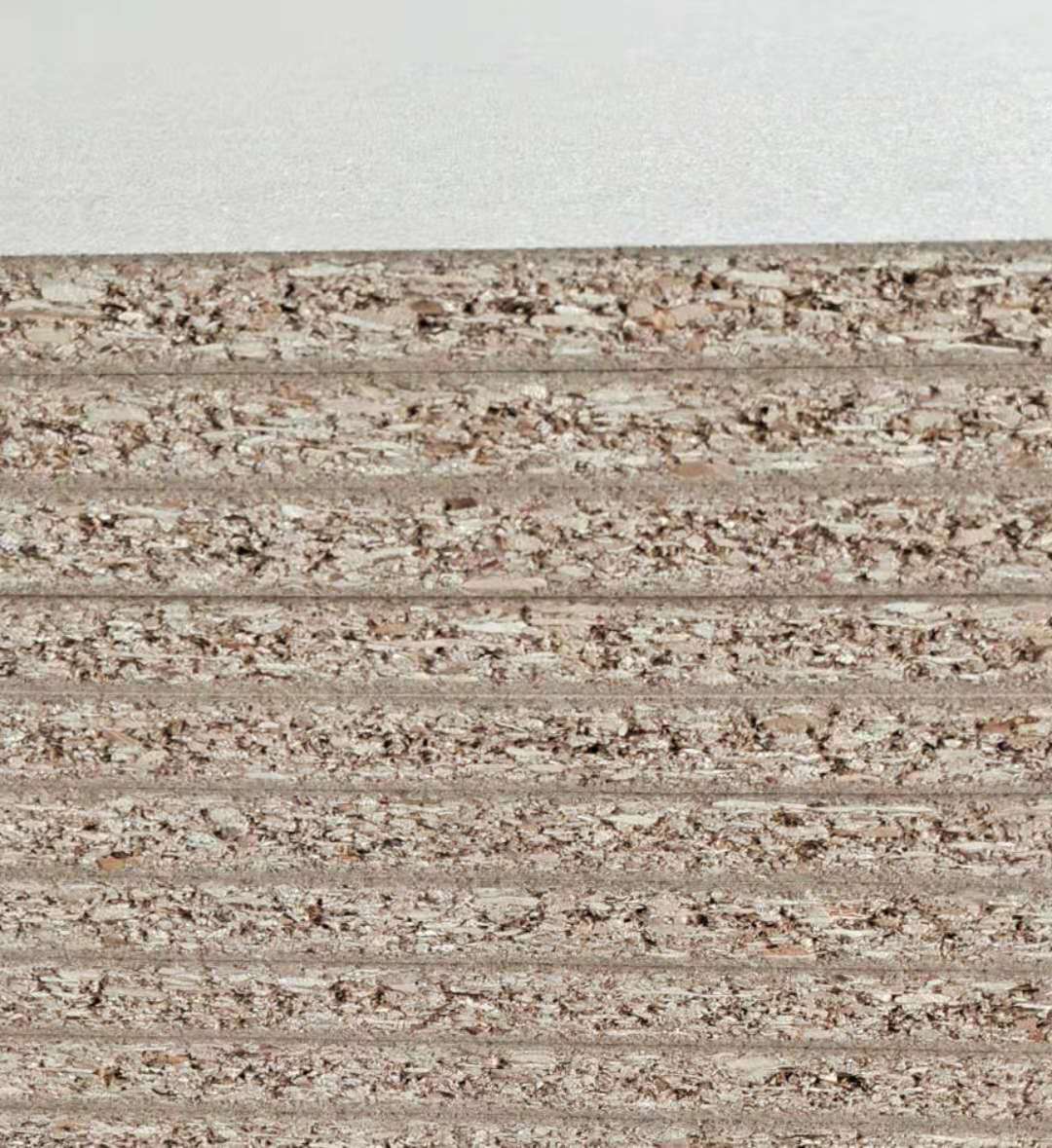 供应衣柜免漆板e0实木颗粒刨花板 橱柜电脑桌面板木板材定制加工