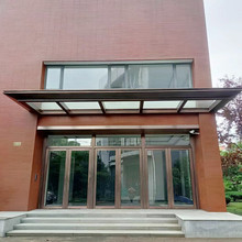 雨棚办公楼门头透明夹胶玻璃遮雨棚包边做旧铜拉丝板包边造型制定