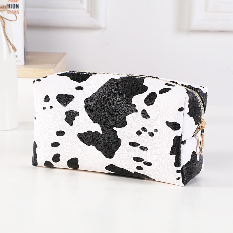New Internet Celebrity Black and White Cows Pattern Cosmetic Bag Wash Bag Portable Women's Handbag Multiple Options