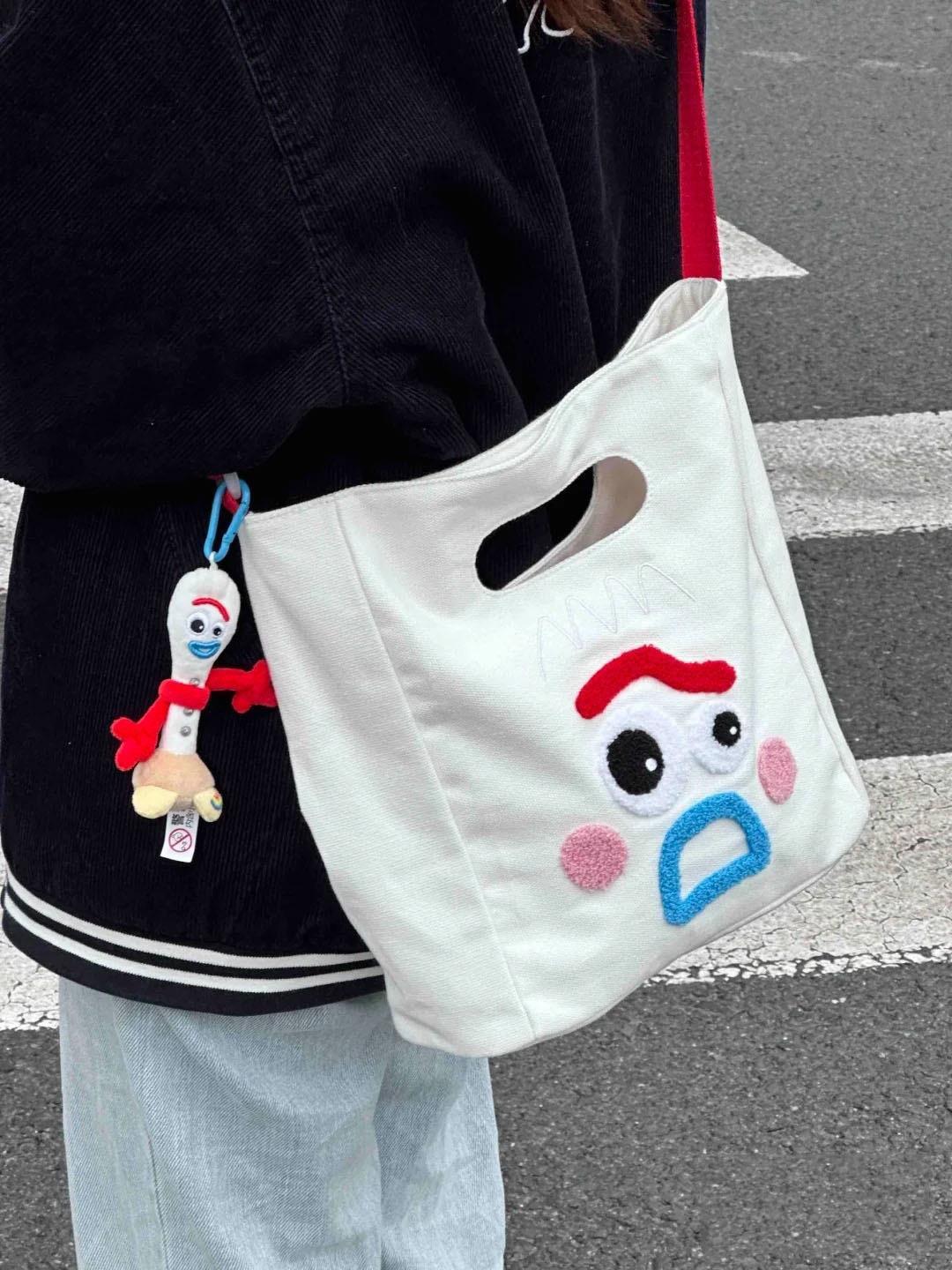 搞怪表情迪士妮帆布休闲斜挎包2023新款大容量通勤包包手提单肩包