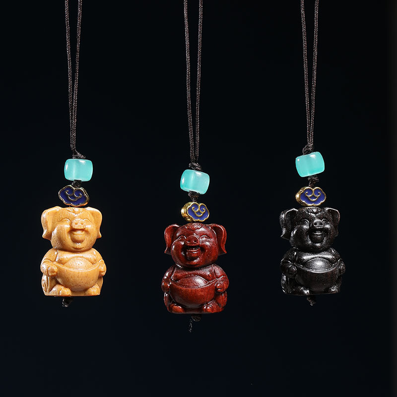 印尼紫檀檀香黑檀木雕刻十二生肖元宝猪手机链情侣背包挂件-阿里巴巴