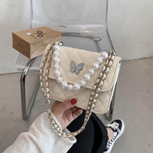 包邮上新冬季流行质感珍珠手提斜跨小包包女2021新款潮洋气质感菱