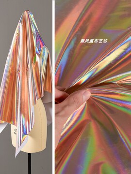 超亮幻彩金色镜面皮革面料 镭射炫光七彩反光无弹背景布时装布料