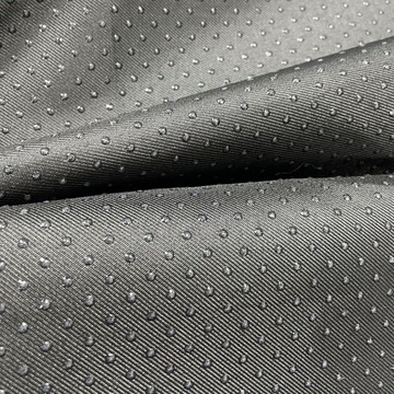 现货华达呢斜纹布滴塑布防滑点点滴塑面料沙发坐垫点塑布鞋滴胶