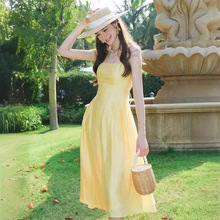 法式露背性感黄色吊带连衣裙2024夏季新款腰节打条收腰显瘦长裙子