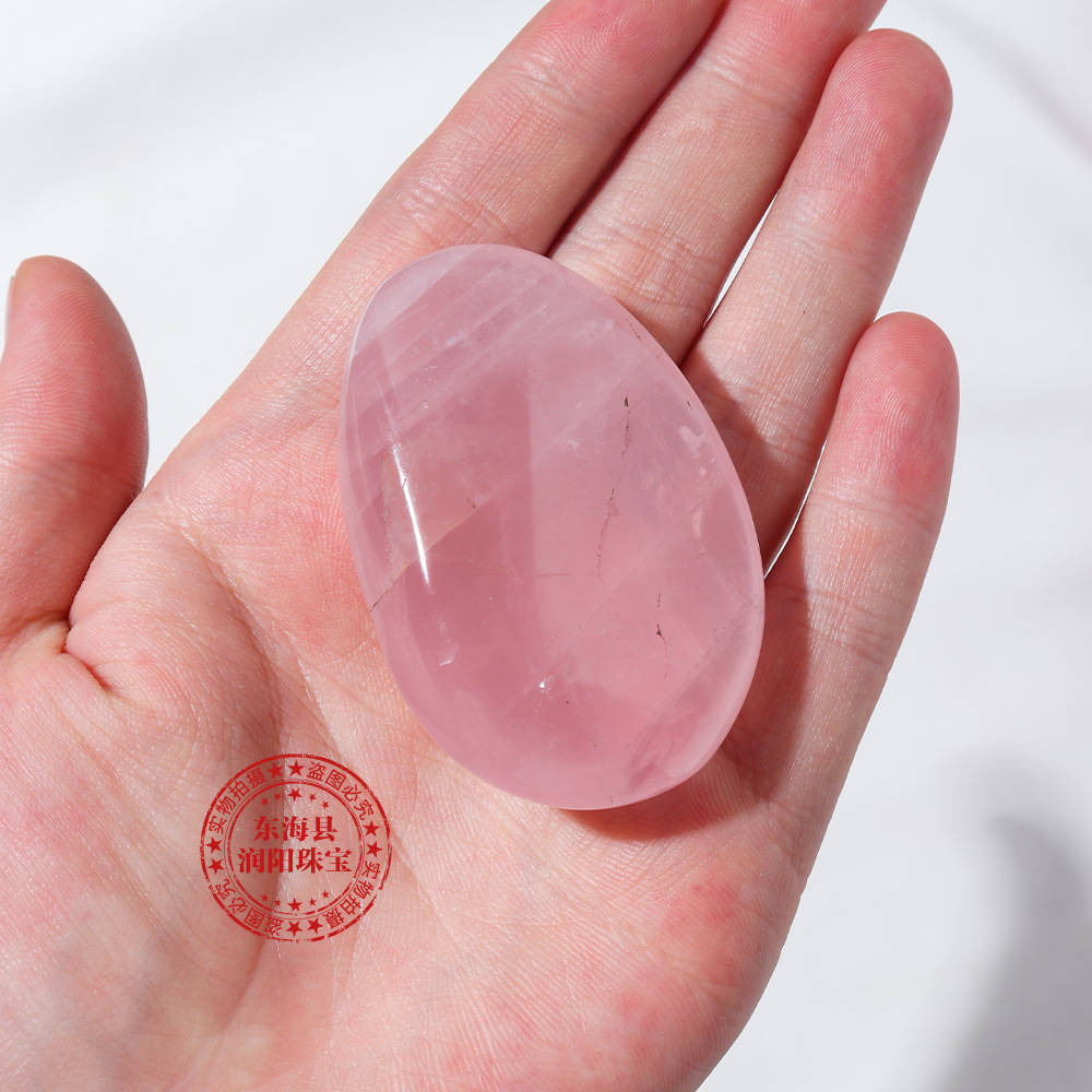 热销东海天然水晶粉晶椭圆手把件手工抛光宝石装饰摆件厂家批发