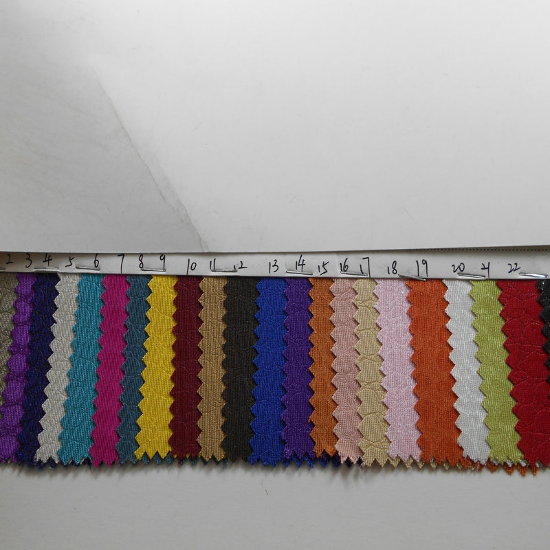 有光涤纶压花布山东绸压花石头纹防水PU牛津布箱包手袋装饰布面料