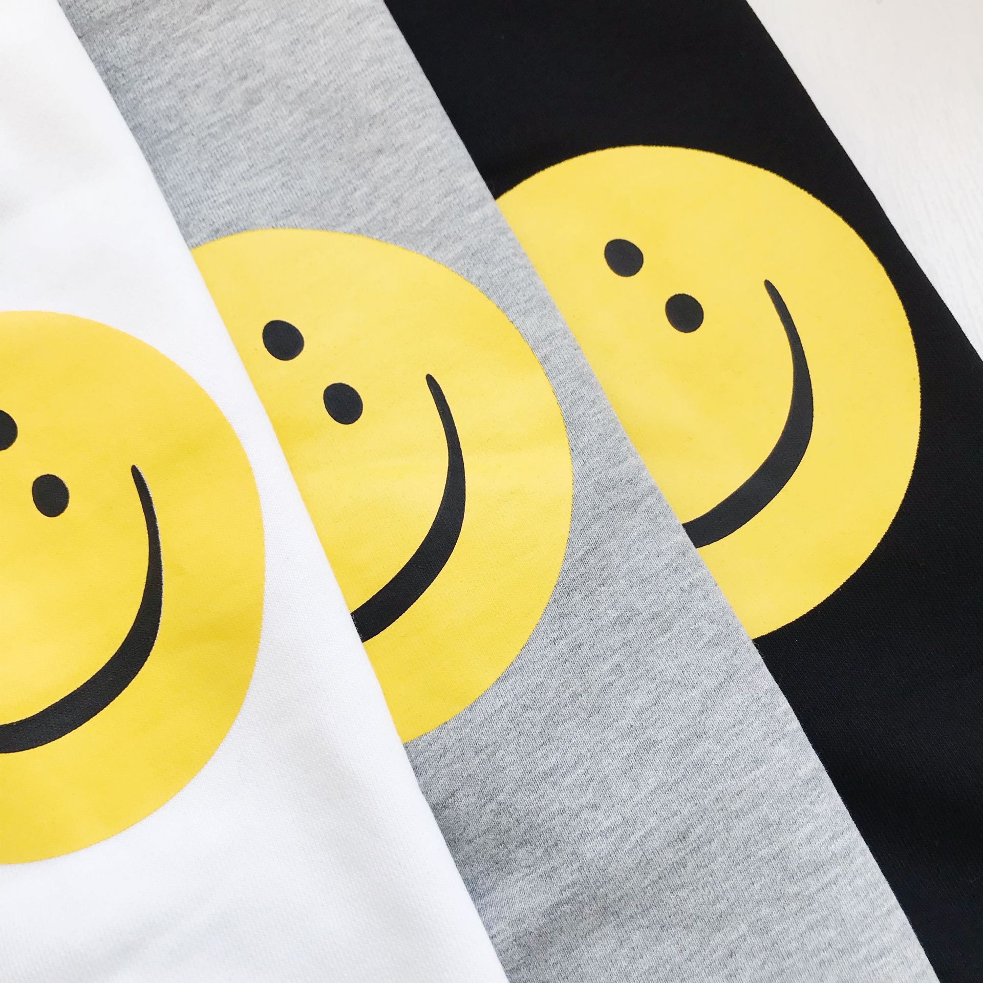 货号24a23909早春新款日系袖笑脸印花休闲宽松情侣圆领卫衣-阿里巴巴