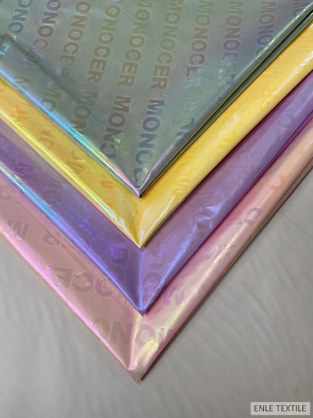 春亚纺幻炫彩珠光字母 离型纸转移膜 幻彩烫金羽绒服面料高亮七彩