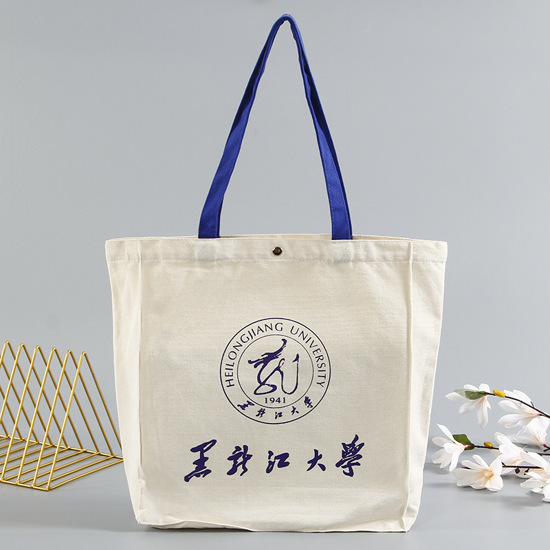 印花帆布袋定做学院宣传礼品棉布购物袋按扣手提帆布袋定制logo